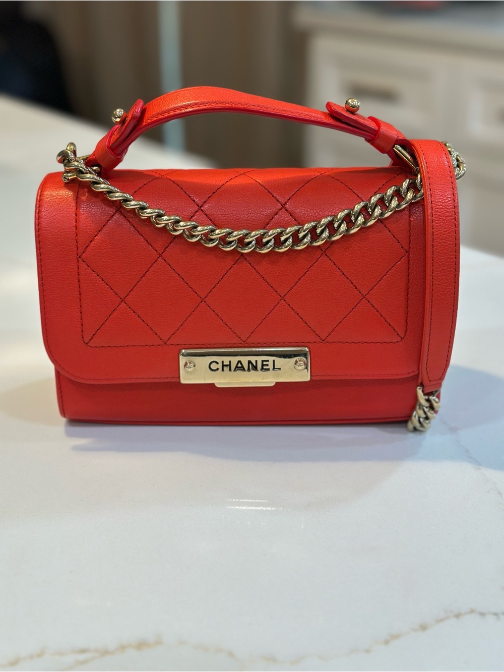 CHANEL Quilted Orange/Red Top Handle Bag with Champagne gold crossbody strap
